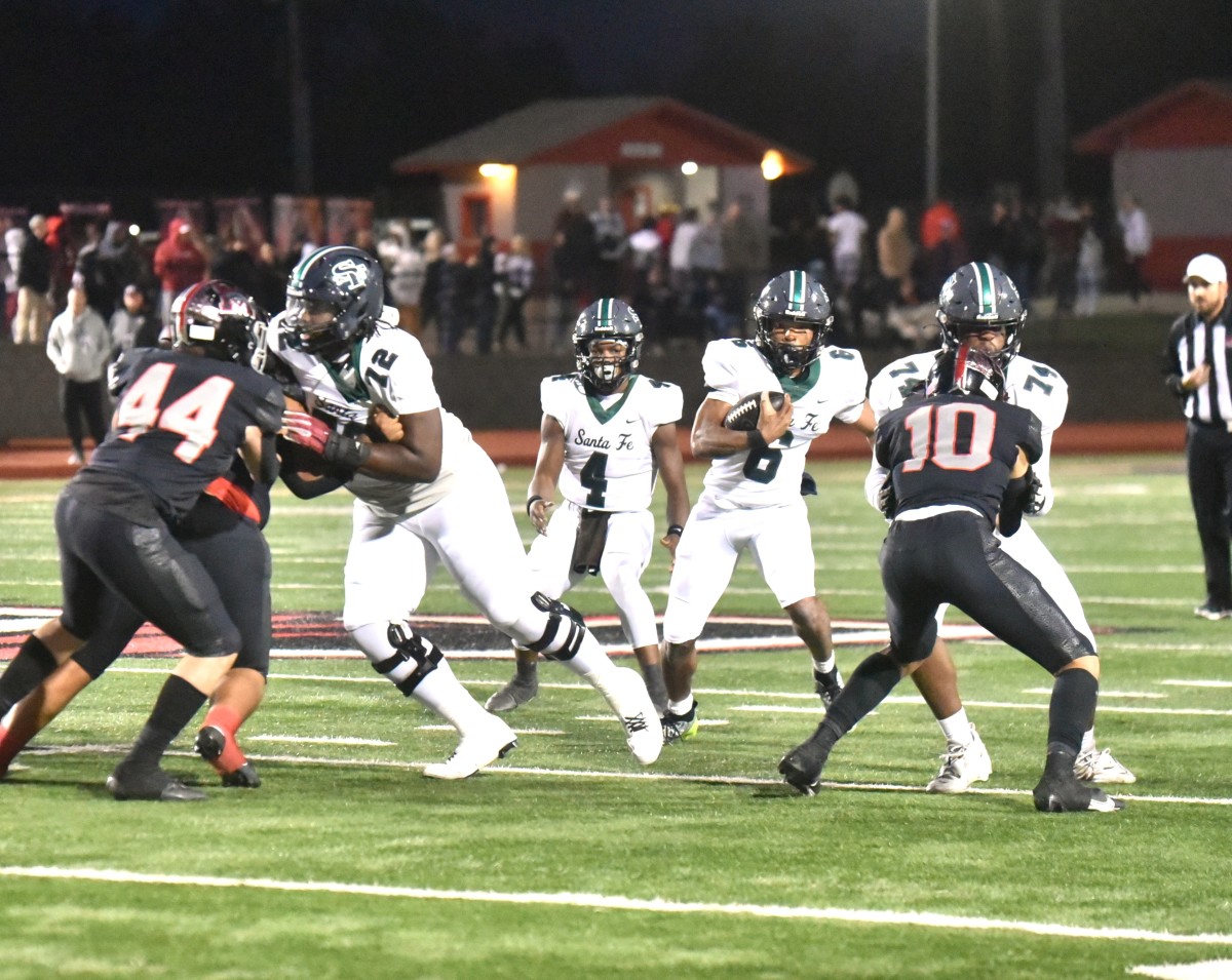 Edmond Santa Fe junior tailback Demarius Robinson (with ball) has helped the Wolves to a 4-1 start this season after a 1-9 finish a year ago.